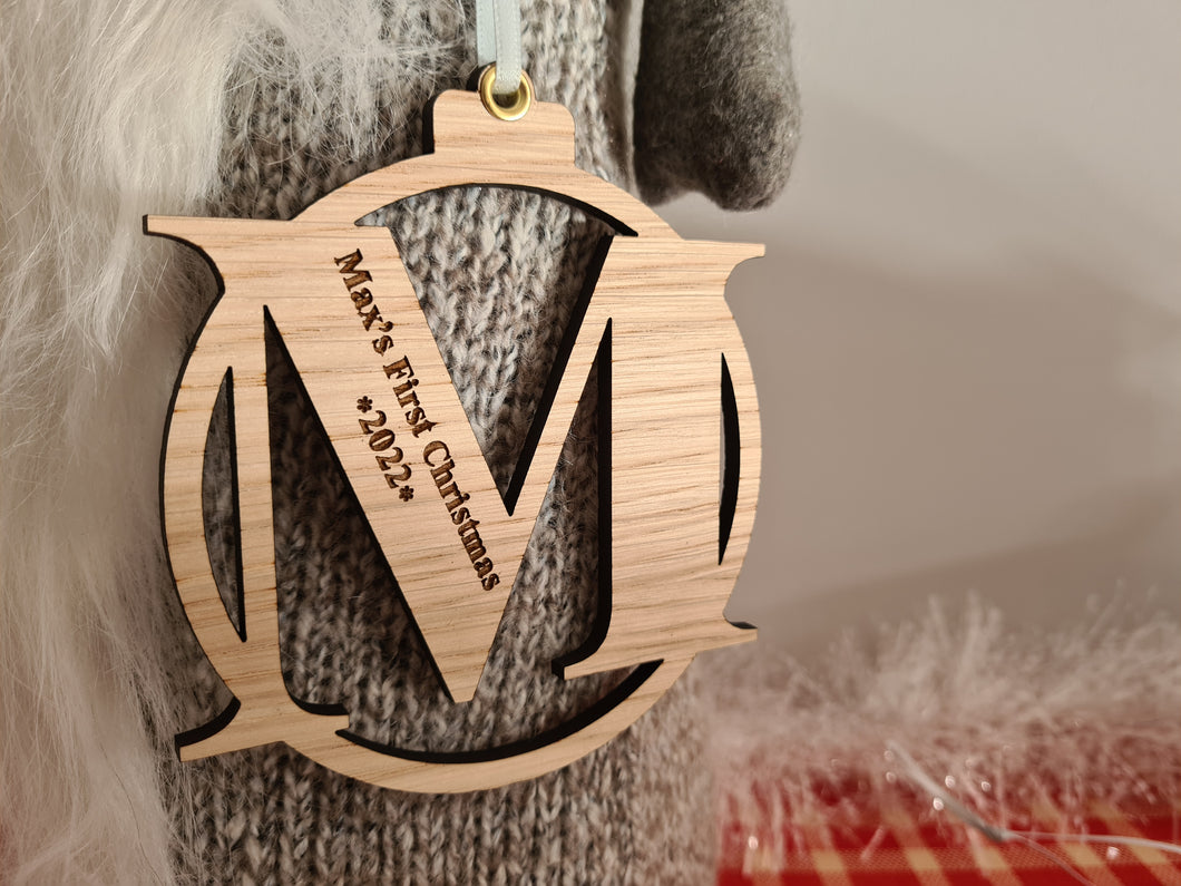 First Christmas Engraved Oak Letter Christmas Bauble